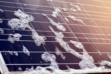 Closeup photovoltaic panel which had waterdrops and sponges on the surface, soft and selective...