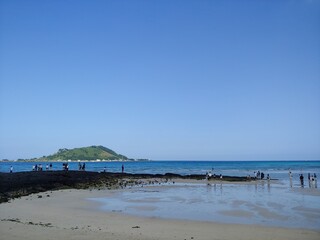 Fototapeta na wymiar Blue beach in Jeju Island