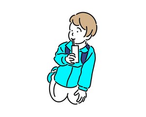 ジュースをストローで飲む小さな男の子