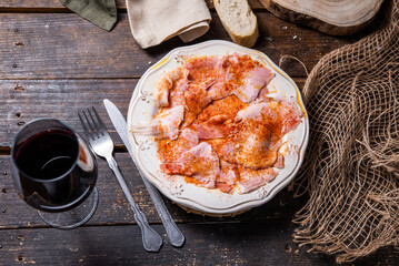 Typical Spanish tapa, Galician lacón, cut pork, with potatoes, paprika and olive oil. Appetizer, lunch or dinner.