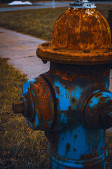 A rusted fire hydrant on the side of a road in Middlefield, Ohio