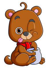 The cute bear is sitting while holding a sack of honey