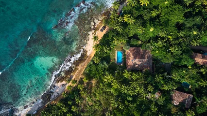 Fototapeten Bali Aerial view of a villa with a swimming pool in the tropics. Hiriketiya beach, Sri Lanka  © Dima Anikin