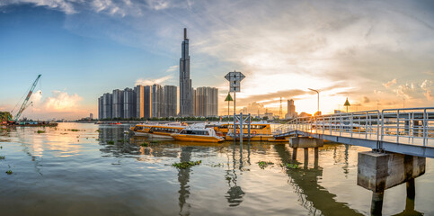 Riverside cityscape under beautiful sunset at evening in Saigon, Vietnam