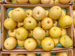 Pile of ripe yellow Asian pears for sale at hypermarket