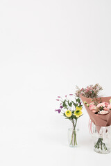 a bouquet of flowers in a glass vase Isolated on white background and space for your text. Copy space advertising mock up. Valentine's Day Women's Day birthday holiday party concept