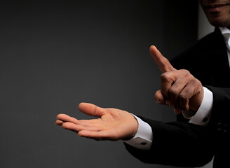 businessman pointing his finger in the office with a suit stock photo