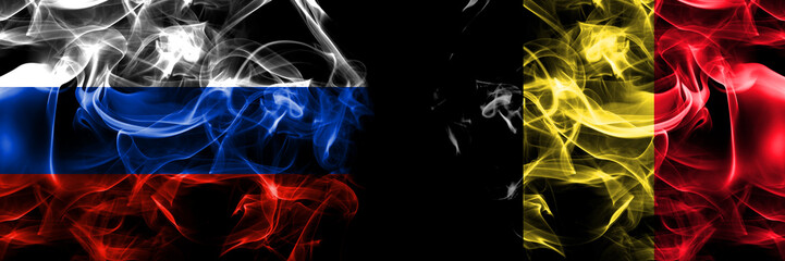 Russia, Russian vs Belgium, Belgian flags. Smoke flag placed side by side isolated on black background