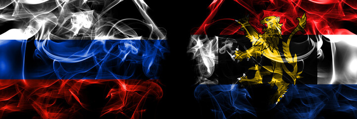 Russia, Russian vs Benelux flags. Smoke flag placed side by side isolated on black background