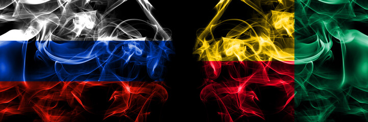 Russia, Russian vs Benin, Beninese flags. Smoke flag placed side by side isolated on black background