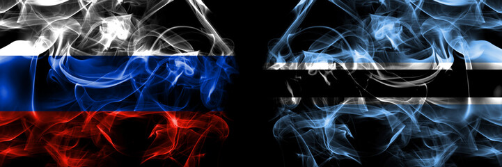 Russia, Russian vs Botswana, Batswana flags. Smoke flag placed side by side isolated on black background