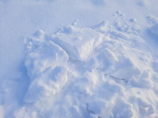 Fototapeta na wymiar Pieces of snow of various shapes