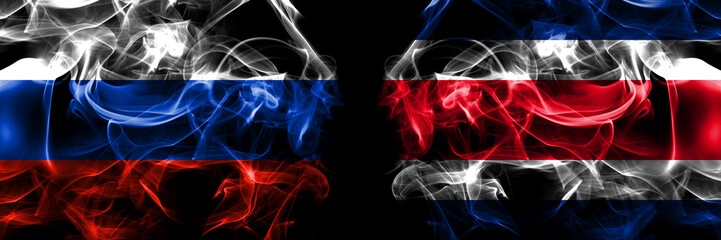 Russia, Russian vs Costa Rica flags. Smoke flag placed side by side isolated on black background