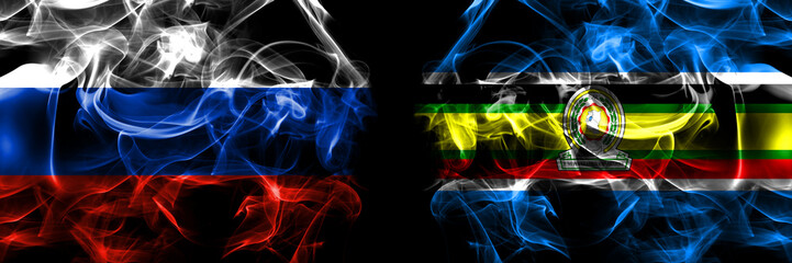 Russia, Russian vs East African Community, Africa flags. Smoke flag placed side by side isolated on black background