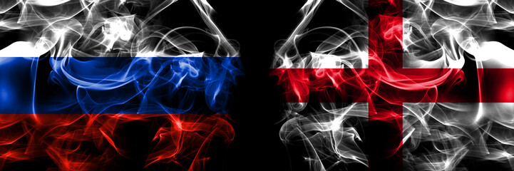 Russia, Russian vs England, English flags. Smoke flag placed side by side isolated on black background