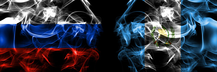 Russia, Russian vs Guatemala flags. Smoke flag placed side by side isolated on black background