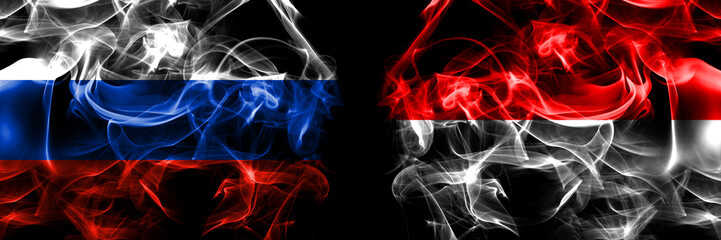 Russia, Russian vs Indonesia, Indonesian flags. Smoke flag placed side by side isolated on black background