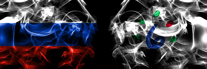 Russia, Russian vs Japan, Japanese, Ishikari, Hokkaido, Ishikari, Subprefecture flags. Smoke flag placed side by side isolated on black background