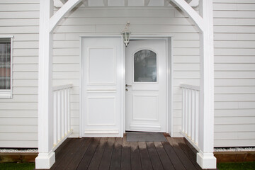 white door entrance of home wooden facade house architecture detail style New Orleans Louisiana