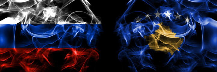 Russia, Russian vs Kosovo, Kosovar flags. Smoke flag placed side by side isolated on black background