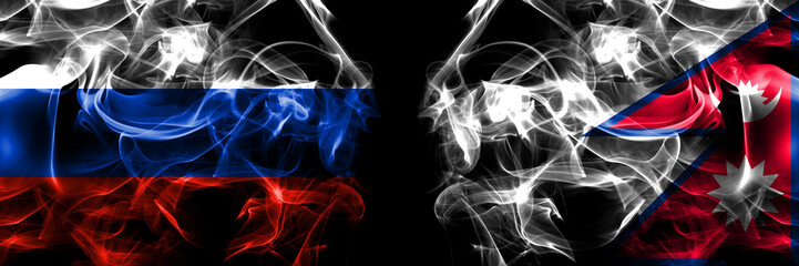 Russia, Russian vs Nepal, Nepali, Nepalese flags. Smoke flag placed side by side isolated on black background