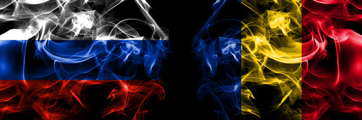 Russia, Russian vs Romania, Romanian flags. Smoke flag placed side by side isolated on black background