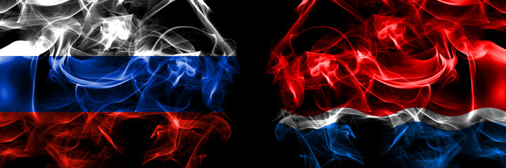 Russia, Russian vs Russia, Amur Oblast flags. Smoke flag placed side by side isolated on black background