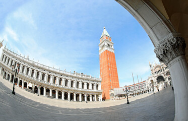 Fototapeta na wymiar bell tower of san marco in venice with few people during the lockdown photographed with fisheye lens with super wide angle effect
