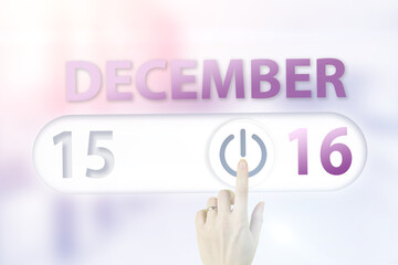 December 16th. Day 16 of month, Calendar date.Hand finger switches pointing calendar date on sunlight office background. Winter month, day of the year concept.