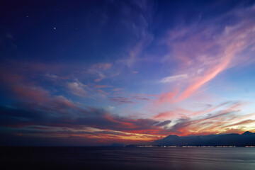 Naklejka premium Dusk and dawn landscape. Beautiful Antalya sea bay at evening time.