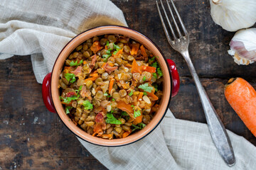 Green lentils stew with white wine, Serrano ham and smoked paprika