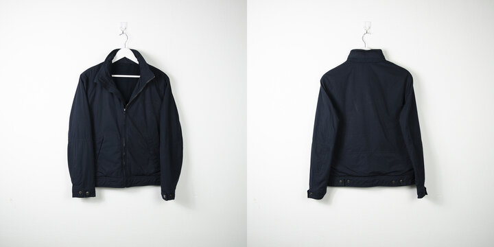 Clothes on a hanger. White wall background. 