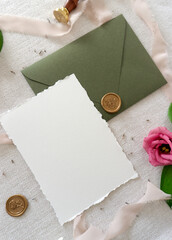 Mockup invitation, blank paper greeting card, floral background, card with envelope, flat lay with roses