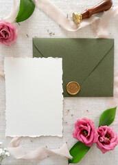 Mockup invitation, blank paper greeting card, floral background, card with envelope, flat lay with roses