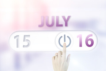 July 16th. Day 16 of month, Calendar date.Hand finger switches pointing calendar date on sunlight office background. Summer month, day of the year concept.
