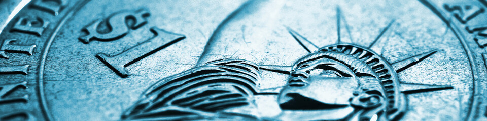 Fragment of US American 1 one dollar coin. Statue of Liberty and the symbol of national currency. Financial banner about USA economy and money. Light blue tinted headline. Macro © Deacon docs
