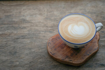 Fototapeta na wymiar cup of hot coffee on wooden table