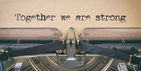 Text written with a vintage typewriter - Together we are strong
