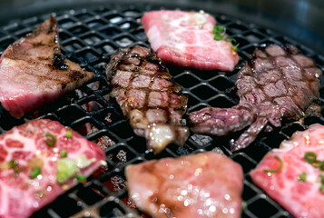 Raw beef slice on grille for barbecue or Japanese style yakiniku