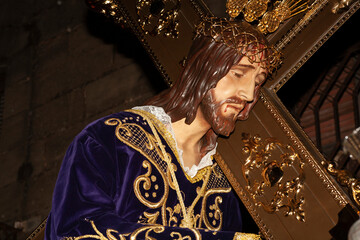 Typical images of the Spanish Holy Week. Procession of Jesus Christ on the cross and the Virgin...