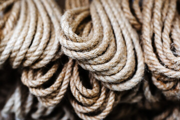Coils of ropes made from natural materials. Manufacture and sale of household accessories. Close-up