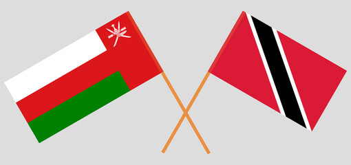 Crossed flags of Oman and Trinidad and Tobago. Official colors. Correct proportion