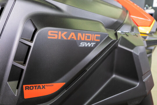 Rostov-on-Don, Russia - May 6, 2021: Close up of new BRP Ski-Doo Skandic SWT sign on snowmobile set out in showroom for sale