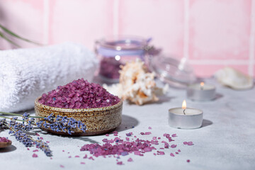 Purple bath salt with lavender, towel and candles