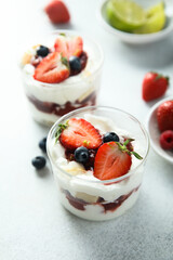 Homemade berry trifle with almond flakes