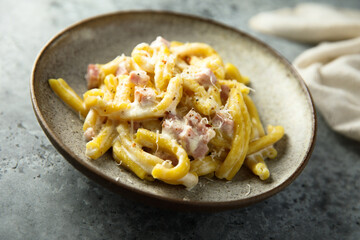 Traditional homemade pasta Carbonara with cheese and ham