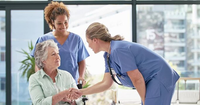Let me attend to that. Beautiful nurse using a stethoscope to listen to senior patient heartbeat in hospital. Two medical nurses helping senior woman in wheelchair in clinic, listening, breathing