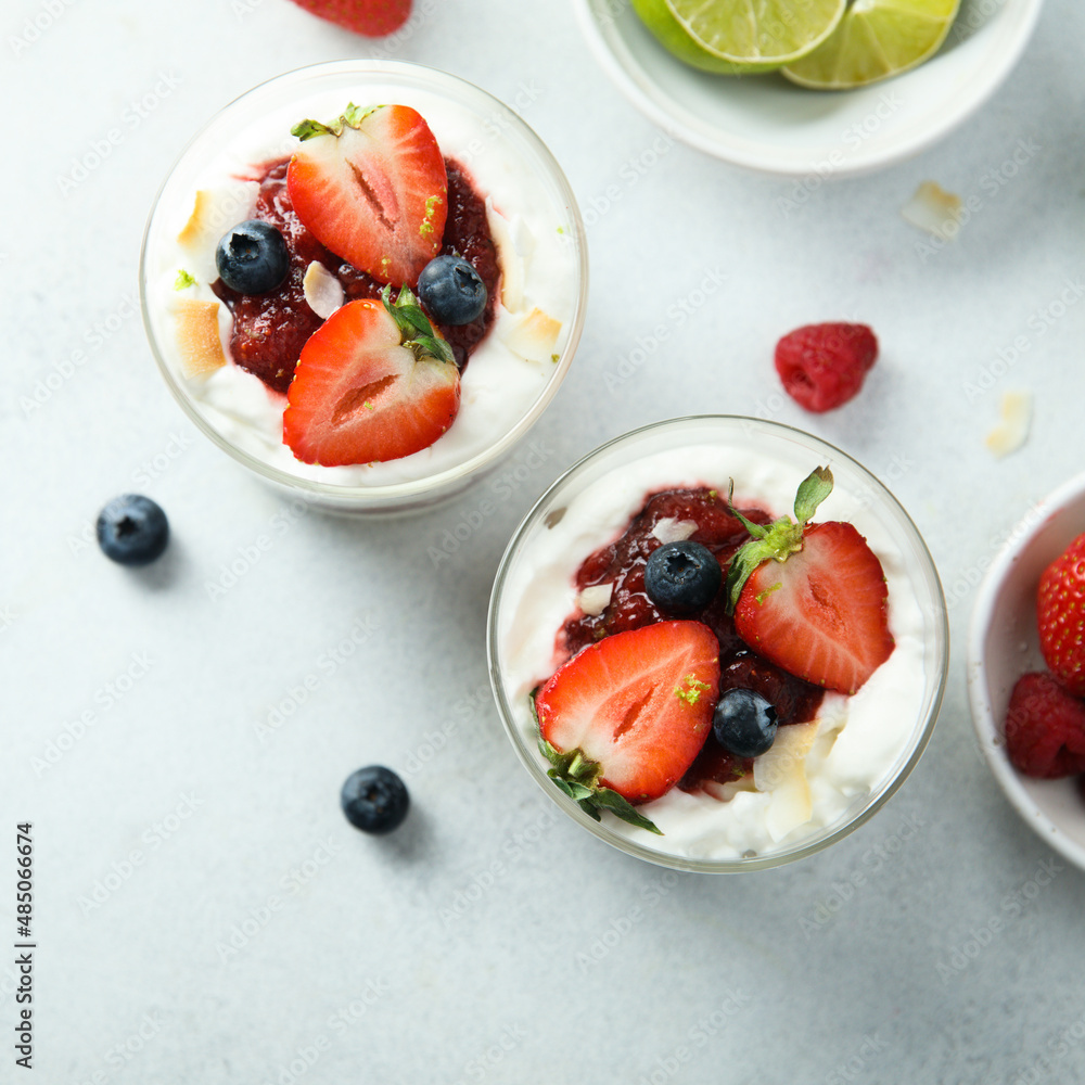 Poster homemade berry trifle with almond flakes