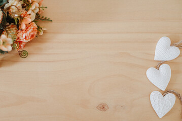 wooden table with an flowers and a heart