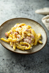 Traditional homemade pasta Carbonara with cheese and ham